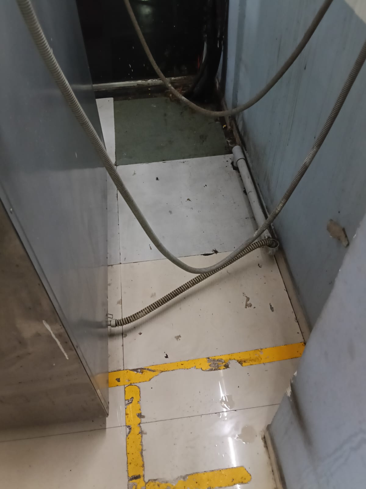 Clean mopped corner behind appliances after detailed cleaning